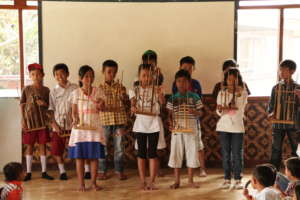 Learning to play the "angklung",a local instrument