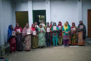 Women with literacy materials