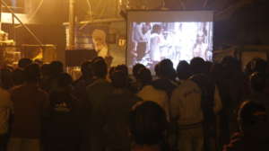 Screening of film in progress in a community