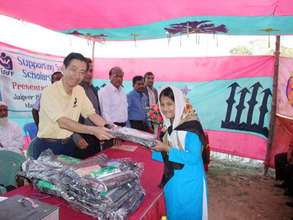 Student Receiving School Uniform and Supplies