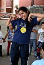 Dalila having fun teaching a new game to the kids.