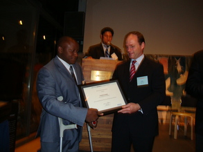 Fredrick receiving YouthActionNet Award