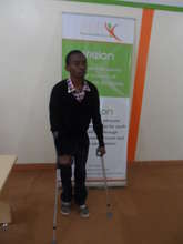 A recipient of an elbow crutch donation
