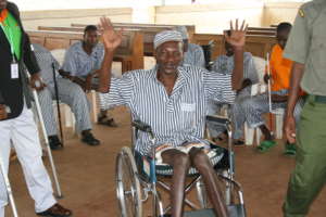 Smiling after receiving a wheelchair donation