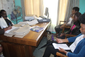 in the school head's office finalizing enrolment