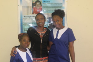 Sisters Nyengeterai and Angeline w/ FAWEZI rep Nqo
