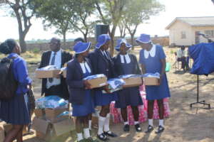beneficiaries receive uniforms and sanitary wear