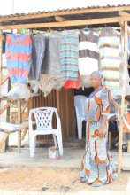A project beneficiary in her clothes shop