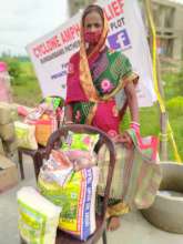 Beneficiary with food parcels