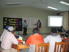 Stakeholder meeting participants learn about Alejandro's goals
