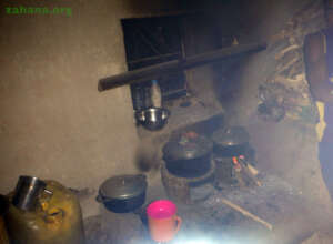 Cooking with improved cookstove in village kitchen