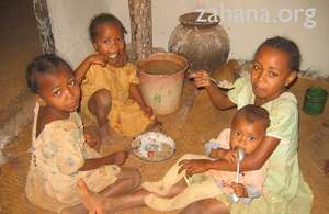 Children enjoying their breakfast of rice
