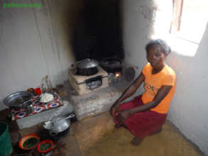 2 improved cookstove models in a village kitchen