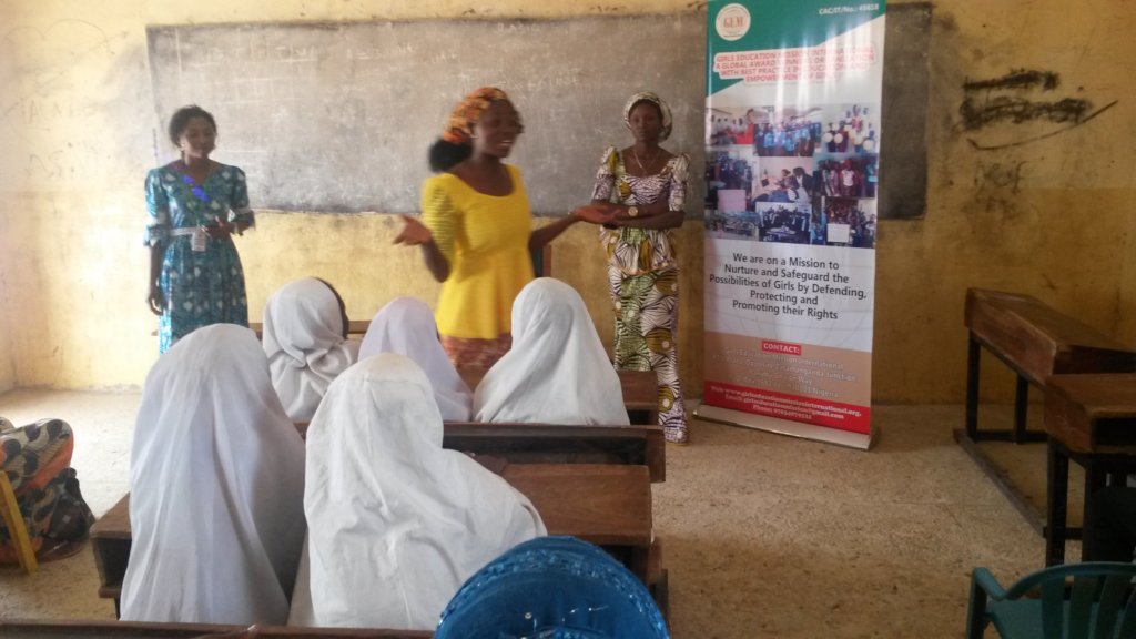 Lois sharing her story to school girls at an event