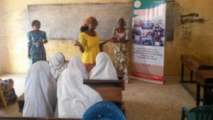 Lois sharing her story to school girls at an event