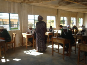 Rebecca class taking notes giving by a teacher