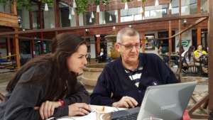 Andrea with Maria, looking up the projects