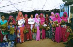Beneficiary women giving thanks to GG