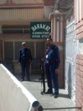 Guards outside Barakat Elementary