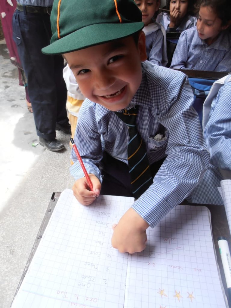 Hard at work but have time to smile for the camera