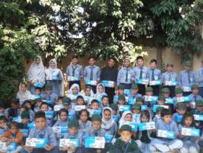 Our students with new shoes, books and uniforms!