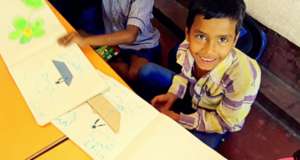 Shibu of UKG - All smiles; with his drawing