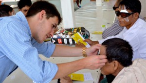 Volunteer Working with an Eye Patient