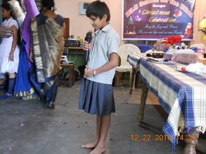 One student performs at the Christmas celebration