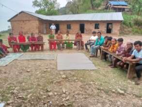 Parents meet with the old school behind them