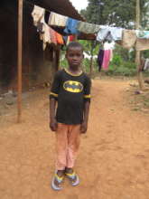 Leonel is standing in front of his home