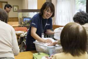 Yuka facilitating group discussion and activities