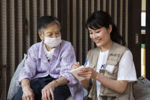 International Medical Corps staff helps a survivor