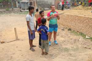 A volunteer with some of the children