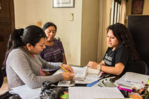 Tania, right, meets with promotoras regularly