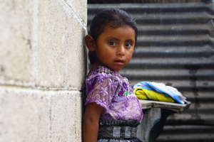 Little girl plays while her mother talks to WINGS