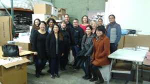 VIDA Volunteers sorting supplies at the warehouse