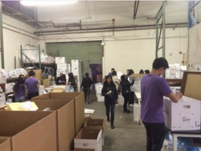 VIDA Volunteers sorting supplies at the warehouse