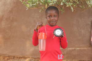 Boy with new solar light study africa