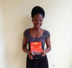 Aminata holding her new solar light