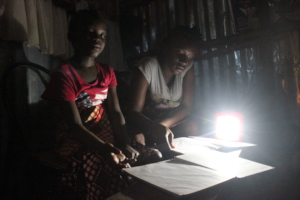 Bintu and her sister using the new solar light