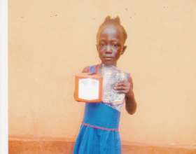 Village girl with new solar light