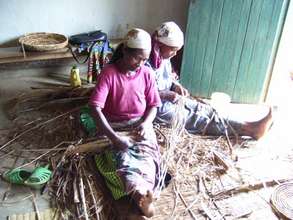 Rwandan women weaving floor mats