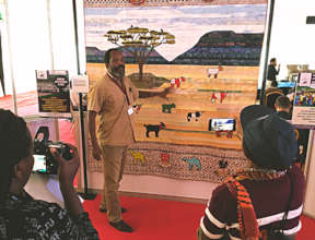 Hilary from CPIK uses the Cow Quilt at ICPD25