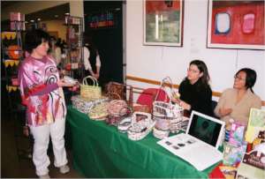 Mariko sells Malaysian baskets, 2007