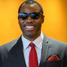 Wilson offers inspiration to his host in Uganda