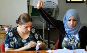 Sewing tiles for the refugee quilts in Jordan