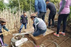 Bachillerato students during latrine construction