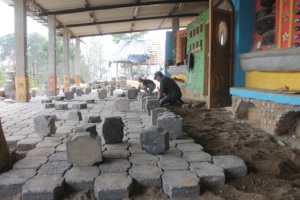 Reutilizing cobble stone to pave our school