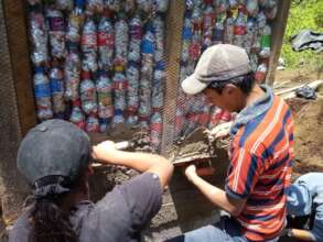 Students build composting toilet with "eco-bricks"