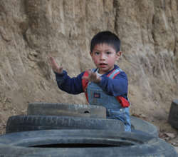 Charlie playing with tire